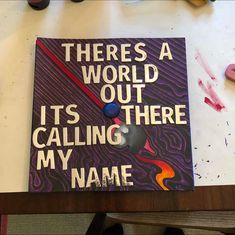 there's a world out it's calling my name book on the table