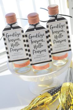 three bottles of gingham on a table with confetti and streamers