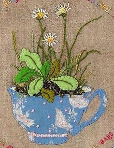 a painting of flowers in a tea cup