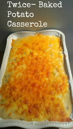 a casserole dish with cheese on top and the words twice - baked potato casserole