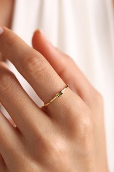 Gift 14k Gold Emerald Ring, Minimalist Gold Emerald Birthstone Ring, Modern Gold Birthstone Promise Ring, Modern Gold Promise Birthstone Ring, Gold Sapphire Wedding Ring For May Birthstone, Modern Gold Emerald Ring Gift, Gold Birthstone Ring With Bezel Setting For Promise, Gold Solitaire Birthstone Ring For May, Minimalist Diamond Ring For Anniversary With May Birthstone