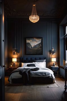 a bedroom with dark blue walls and wood flooring is lit by a chandelier