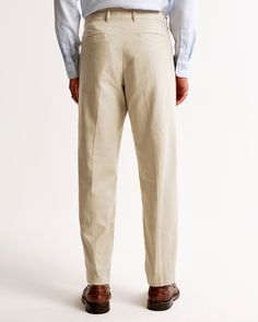 Our BDG classic suit pants in our linen-blend fabric. Tailored loose fit through the leg with a slight taper, featuring a shorter inseam designed to hit at the ankle and give a cleaner visual. For a standard visual, choose a longer inseam. Classic Chinos For Business Casual In Summer, Classic Summer Chinos For Business Casual, Classic Fitted Linen Chinos, Classic Solid Summer Dress Pants, Classic Unstructured Bottoms For Spring, Classic Summer Chinos For Workwear, Classic Linen Chinos With Pockets, Classic Linen Pants With Pockets, Classic Summer Workwear Chinos