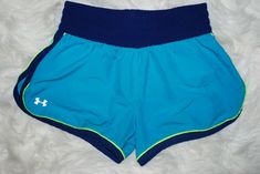 Excellent condition, rarely worn Under Armour HeatGear Aqua Blue / Lime High-Waisted Shorts available in Women's X-Small.  High-waist Semi-Fitted style.  Elastic waistband with tightening drawstring.  Equipped with HeatGear technology that keeps you cool, light and dry under all conditions.  Anti-odor technology keeps your gear fresher, longer.  100% Polyester, Machine Cold Wash and Tumble Dry recommended.  Guaranteed 100% Authentic.  Shipping: Ships quickly to anywhere in the US with free track Blue Under Armour Bottoms With Built-in Shorts, Under Armour Short Bottoms With Pockets, Under Armour Blue Bottoms For Summer, Under Armour Summer Blue Bottoms, Under Armour Shorts With Pockets, Blue Under Armour Sports Shorts, Under Armour Blue Sports Shorts, Under Armour Fitted Short Bottoms, Sporty Blue Under Armour Bottoms