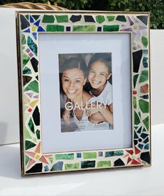 a multicolored photo frame with the words gallery written on it in white lettering