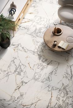 a living room with marble flooring and furniture