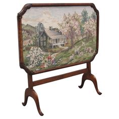 an old wooden frame with a painting on the front and side of it that has sheep grazing