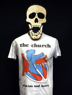 Of Skins and Heart is the debut album by the Australian psychedelic rock band The Church, released in April 1981 by EMI Parlophone. 23tees specialises in T-shirt design based on iconic record releases from the punk and post punk era.  We celebrate a truly inspired time in musical history by choosing a wide range of releases from both famous and more obscure bands.      T-shirts are made using the latest direct-to-garment technology - the ink is directly printed and sealed into the garment for a quality, durable and soft-finish shirt. Retro White T-shirt With Heart Graphic, White Fitted T-shirt For Concert, Fitted Band Merch T-shirt With Logo, Fitted Band Logo T-shirt, White Music-themed Graphic T-shirt, White Music-themed T-shirt With Graphic Design, Music-themed White Graphic T-shirt, Music-themed White T-shirt With Graphic Design, White Music-themed T-shirt With Band Logo