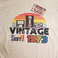 The YEAR ON THIS SHIRT IS CHANGEABLE! Please in the note to seller when purchased, put the year you wish it to be! This original design is a great retro and vintage look for anyone born in the 70's and 80's.  Back when cassette tapes and Vcr tapes ruled the world! This birthday shirt would make a great gift idea for anyone. It is sublimated on a bella canvas soft oatmeal colored unisex tee.  Can be printed on any size shirt Wash in cold water, inside out to maintain brightness Vcr Tapes, Small Birthday Gifts, Oatmeal Color, Cassette Tape, Retro Shirts, Great T Shirts, Cassette Tapes, Graphic Tees Women, Birthday Shirts