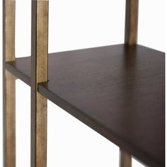 a wooden shelf with two metal bars on the bottom and one is brown in color