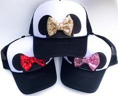 three minnie mouse hats with bows on them