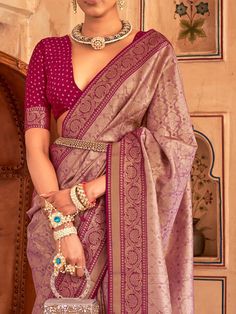 With its captivating purple color and intricate zari weaving work, this elegant silk saree is a true masterpiece. Crafted with meticulous attention to detail, the saree is made from high-quality silk material that feels luxurious against the skin. The entire saree is adorned with exquisite zari weaving work, adding a touch of opulence to its already regal appearance.
One of the standout features of this saree is the attached tassels on the pallu, which give it a stylish and contemporary look. Th Elegant Jamawar Pre-draped Saree For Wedding, Elegant Wedding Pre-draped Jamawar Saree, Elegant Pre-draped Jamawar Saree With Pallu, Elegant Pink Choli With Zari Weaving, Purple Dola Silk Pre-draped Saree With Self Design, Designer Purple Banarasi Silk Choli, Designer Purple Tussar Silk Saree, Designer Wear Banarasi Silk Purple Choli, Designer Banarasi Silk Choli In Purple