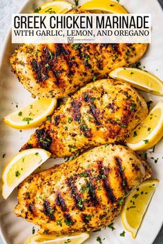 grilled chicken marinade with garlic, lemon and oregano on a white plate