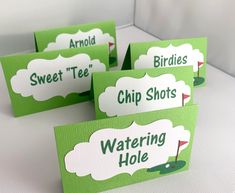 four green and white place cards with the words, sweet tees, chip shots, watering hole