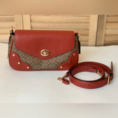 Coach Shoulder/Crossbody Bag Nwt Signature Coated Canvas And Refined Pebble Leather Inside Zip Pocket Turnlock Closure, Fabric Lining Detachable Handle With 8 3/4" Drop Outside Zip Pocket Detachable Strap With 21 3/4" Drop For Shoulder Or Crossbody Wear 10 3/4" (L) X 6" (H) X 2 3/4" (W) Coach Crossbody Flap Bag With Removable Pouch, Coach Crossbody Saddle Bag, Coach Crossbody Saddle Bag With Detachable Strap, Coach Saddle Bag With Detachable Strap And Crossbody Shape, Coach Saddle Bag With Detachable Strap, Autumn Olive, Coach Tabby, Swan Print, Blue Coach