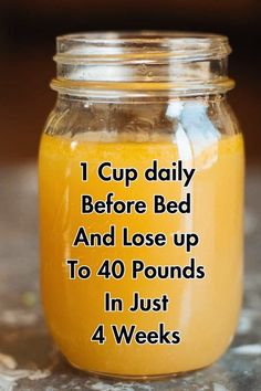 a jar filled with liquid sitting on top of a table