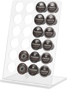 a display case with coffee beans on the bottom and two rows of buttons in each