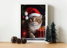 a cat wearing a santa hat sitting next to a christmas tree