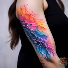 a woman's arm with colorful lightning tattoo on her left arm, and an image of