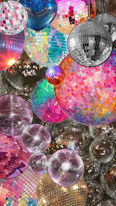 many disco balls are hanging from the ceiling