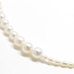 A modern take on the classic pearl strand necklace - round white lustrous pearls meticulously arranged in gradual sizes on one side and small oval pearls on the other. Pearl Strands Necklace, Pearl Strand, Gemstone Engagement, Keshi Pearls, Pearl Strands, Pearl Gemstone, Freshwater Cultured Pearls, Precious Gems, Ring Size Guide