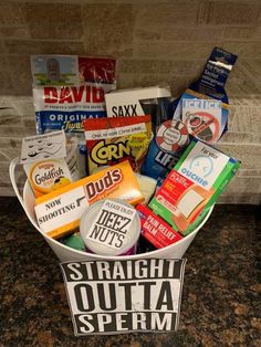 a bucket full of snacks sitting on top of a counter