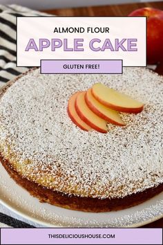 an apple cake with powdered sugar on top and sliced apples in the background text reads, almond flour apple cake gluten free