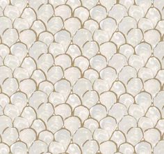 a white and gold wallpaper with fish scales on it