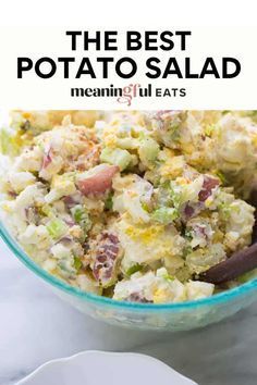 the best potato salad in a glass bowl with text overlay that reads, the best potato salad