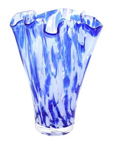 a blue glass vase sitting on top of a white table