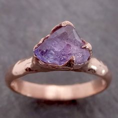 Partially faceted (by my husband) Purple/Lavender Sapphire Solitaire. I hand carved this ring in wax and cast it in recycled solid 14k rose gold using the lost wax casting process. This one of a kind raw gemstone ring is a size 7 it can be resized. The sapphire stone measures about 7mm X 7mm. The bandwidth is about 3mmThroughout all time and history in every tribe and culture all around the world crystals minerals and gemstones have used for healing, luck, divination, adornment vibrational medic Lavender Sapphire, Gemstone Engagement Ring, Rough Diamond Ring, Raw Gemstone Ring, Gold Solitaire Ring, Sapphire Solitaire, Wedding Rings Solitaire, Purple Sapphire, Gemstone Engagement