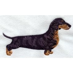 a black and tan dachshund embroidered on a white towel