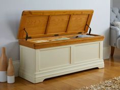 a large wooden chest sitting on top of a hard wood floor