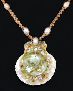 "This pendant is a real seashell that's been filled with genuine mother of pearl, abalone, and a small sand dollar that's been sealed under glass. The necklace is hand braided hemp with freshwater that is adjustable, when fully closed it measures 18\" ... when fully open it measures 24\" in length making it easy to slip over one's head." Handmade Spiral Necklaces For Beach, Adjustable Shell Jewelry With Pearl Charm, Shell-shaped Pearl Pendant Jewelry, Shell-shaped Jewelry With Pearl Pendant, Beach Necklace With Natural Stones And Pearls, Pearl Shell Jewelry For Jewelry Making, Pearl White Shell Jewelry For Beach, Adjustable Shell Necklace With Pearl Pendant As Gift, Handmade Pearl Jewelry For The Beach