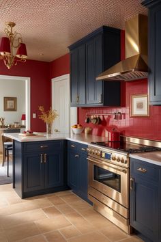 a kitchen with red walls and blue cabinets