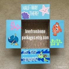 an open cardboard box with some pictures on it and words written in the bottom right corner