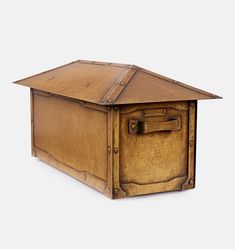 an old wooden box with a metal roof on it's side, isolated against a white background