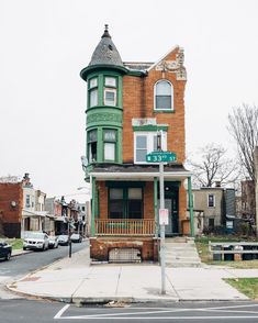 an old brick building on the corner of a street