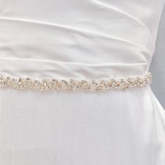 💖 Our Current New Shop Promotion 💖 Get a free 2 pcs CZ Bobby Pin Set with every order! Order now and enjoy the added sparkle and elegance! (: Simple Wedding Belt, Simple Wedding Dress Belt, Bride Dress Belt Enhance your bridal look with the enchanting Simple Wedding Belt. Embrace natural elegance with a stunning strand of pearls and shimmering crystals, perfect for nature-inspired weddings. 💖 Details - Embellishment measures 17.75 inches long and 0.6 inches wide - Handmade with sparkling rhin