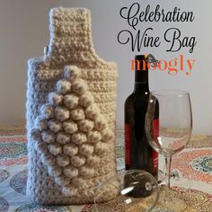 a crocheted wine bottle and glass on a table with the words celebration wine bag