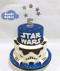 a star wars themed cake with silver stars on top