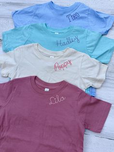 These sweet little toddler t-shirts are the perfect basic for play days. The monogrammed collar is machine embroidered and adds a special personalized touch to a comfortable tee. These are available in sizes 2T-6T, size up for growing room. machine embroidery requires a stabilized backing, this will get softer with wash and wear and become like fabric. it's recommended to wash before wear for softness.  Each tee can be customized with name or short phrase, up to 10 letters is ideal. Font size is approximately 3/4 inch, exact sizing depends on the font and length of name. Thread color can be customized to coordinate with the shirt. If not specified, the default font is Emerson and thread color will be chosen based on shirt color. Kids Monogram Shirts, Girl Monogram Shirt, Flower Girl Shirt, Custom Dog Sweatshirt, Flower Girl Shirts, Monogram Kids, Funny Toddler Shirt, Monogram T Shirts, Monogram Shirts