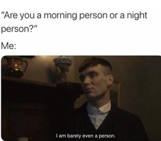 a man is standing in front of a mirror with the caption, are you a morning person or a night person? me i am barely even a person