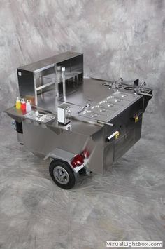 a small food cart sitting on top of a gray background