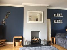 a living room with blue walls and furniture