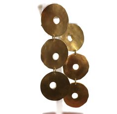 Indulge in the allure of Modernist design with these stunning gilded disc dangle earrings, a masterful design by 1980s Woodstock, New York artisan Nina-Roz Balkin. Measuring a luxurious 3 7/8 inches in length, these kinetic art-inspired earrings sway gracefully, adding a touch of drama as they brush against your shoulders. Crafted with meticulous attention to detail, these earrings feature a skillfully hammered texture, giving each disc a unique, artistic finish. The discs themselves have a one- Woodstock New York, Kinetic Art, Dog Pin, Charm Rings, Earring Findings, Earrings Vintage, Sterling Silver Charm, Woodstock, Vintage Earrings