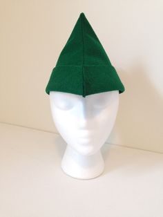 "Let your child believe in the magic of fairy tales as they dress up as Robin Hood, Peter Pan, a woodsman or prince! This adorable forest green felt hat will compliment their active imagination. Look no further for a quality handmade hat to complete a Halloween costume, school play outfit, a themed birthday party or for use as a photography prop. The pan hat also makes a great party favor or a gift for any occasion. The feather is made of two layers of felt and top stitched for quality and durab Green Winter Costume Hats And Headpieces, Green Brimmed Winter Costume Hats, Halloween Costume School, Active Imagination, Robin Hood Hat, Hood Hat, Play Outfit, Believe In The Magic, School Play