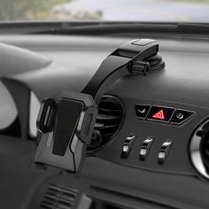 the interior of a car with an electronic device in it's center console and dashboard