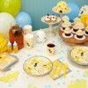 a table topped with cupcakes and other dessert items