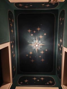 the ceiling is decorated with stars in green and white colors, as well as black background